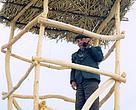 Conservation officer Bairam Jumaev on a fire prevention platform constructed with WWFsupport