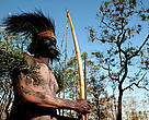 Local tribesman in the TransFly. The head piece is made from the feathers of the cassowary bird. Rhoku, Papua New Guinea.