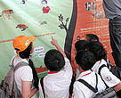 Vietnamese schoolchildren learning about wildlife trade at the opening of WWF-TRAFFIC's new travelling exhibition. Hanoi, Vietnam.