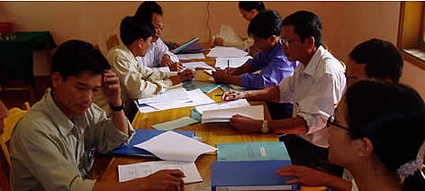 Park managers filling out the RAPPAM questionnaire in Bach Ma National Park, August 2004. rel=