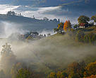 Rural landscape with morning mist near Zarnesti, Transylvania, Southern Carpathian Mountains, Romania.