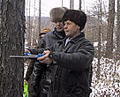 Measuring standing volume of trees.<BR>