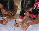 School children helping to construct a 3D model of their commune.
