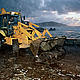 Galicia, Spain - A front end loader cleans the beaches of Muxía, La Coruña, where the fuel oil from the 'Prestige' oil spill was washed into the village. The physical impact of an oil spill can have lasting effects on local and regional economies and the well-being of local communities. © Jorge SIERRA / WWF-Canon