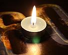 A lit candle on the Earth Hour logo, on the occassion of WWF's Earth Hour 2009 event, Madrid, Spain.