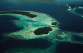 Low-lying islands such as the Soloman Islands above are severely threatened by sea level rise, ... / ©: WWF-Canon / Soh Koon CHNG View of the large and medium-sized islands, and numerous smaller islets, reefs and atolls that ... / ©: WWF-Canon / Soh Koon CHNG