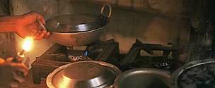 Cooking with a biogas stove, instead of burning firewood, eases the workload of women and saves forests.
