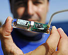 Pablo Cermeño, bluefin tuna officer with the WWF Mediterranean Programme holds up a tuna tracking tag.