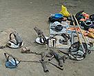 Tools of a terrible trade : leg-hold traps, spears, and knives to kill a tiger along with the cooking utensils and rations of the poachers.