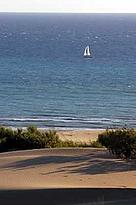 Sand dunes, sailing boat on the Mediterranean Sea in the background. Patara, Turkey. / &copy;: WWF-Canon / Michel GUNTHER