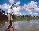 Member of the Fishermens Association of Sena Madureira and Mauel Urbano casts net fishing on one of the lakes in the Purus River system near Sena Madureira. Floorplain Resources Management project int he Upper Purus River Basin, part of one of the WWF Freshwater projects sponsored by HSBC. Acre State, Brazil
