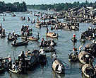 Sampans meet at early morning market in the Mekong Delta where rivers converge Vietnam 