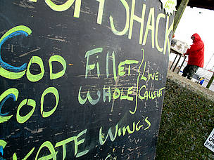 A beach-side fish shop selling fresh, sustainable, line caught cod, Aldeburgh, Suffolk, UK.