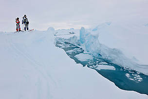 Ann Daniels (in red) and Pen Hadow (in blue), consider how best to cross an open lead in the ice, Catlin Arctic Survey