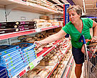 A mother buying pizzas with her children. Many pizzas and other baked food products are made with or contain palm oil. 