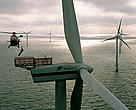 Helicopter lowering a technician to Horns Rev wind farm, Esbjerg, Denmark.