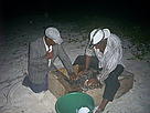 Johanny Cruz (L) helps Pelagio Paulino to tag Adamanay. / ©: Grupo Jaragua/INTEC / ©: Grupo Jaragua/INTEC
